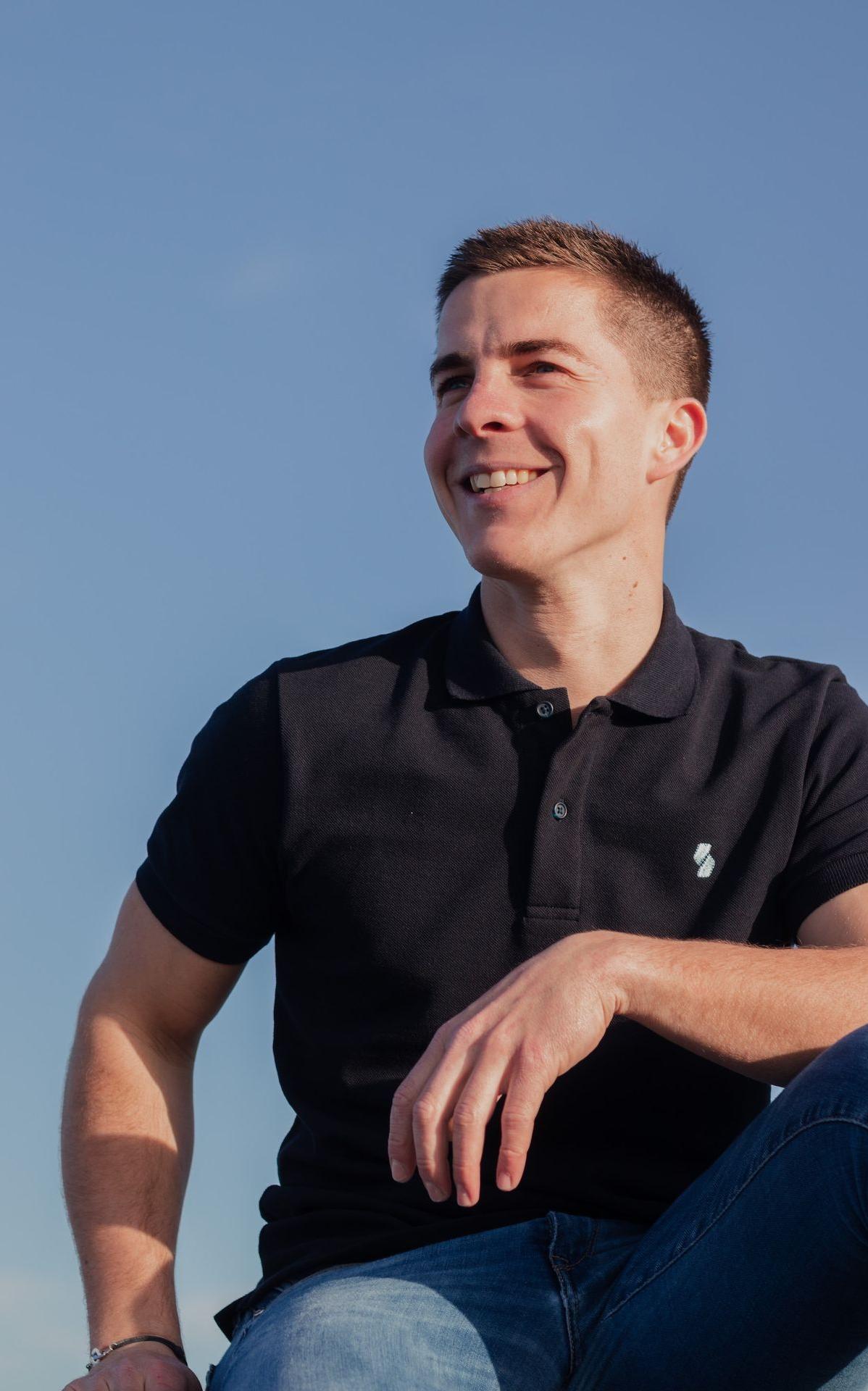 man in black polo shirt